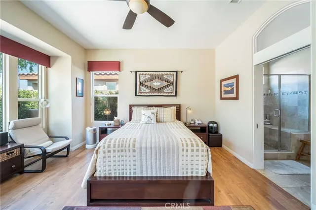 a bedroom with a large bed and a large window