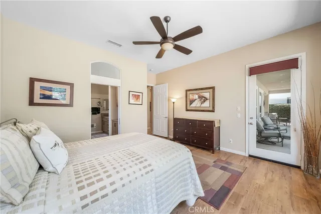 a bathroom with a granite countertop double vanity and a mirror