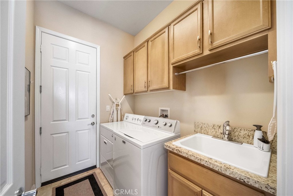 81955 Golden Star Way La Quinta, CA 92253 - Photo 36 of 54 a utility room with dryer and washer