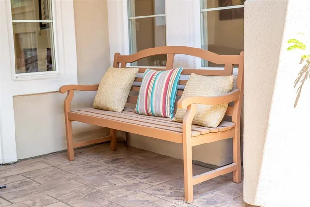 a view of a swimming pool with outdoor seating