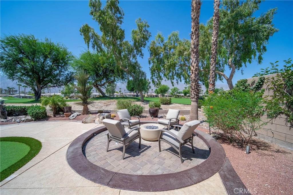 81955 Golden Star Way La Quinta, CA 92253 - Photo 42 of 54 a view of a swimming pool with outdoor seating