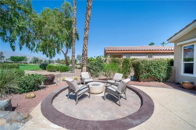 a view of a house with a yard porch and sitting area