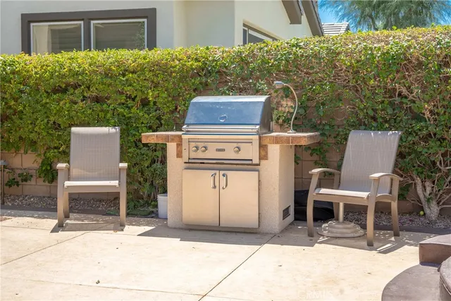 a view of a house with potted plants
