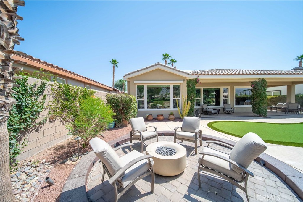 81955 Golden Star Way La Quinta, CA 92253 - Photo 50 of 54 a view of a patio with couches potted plants and a big yard