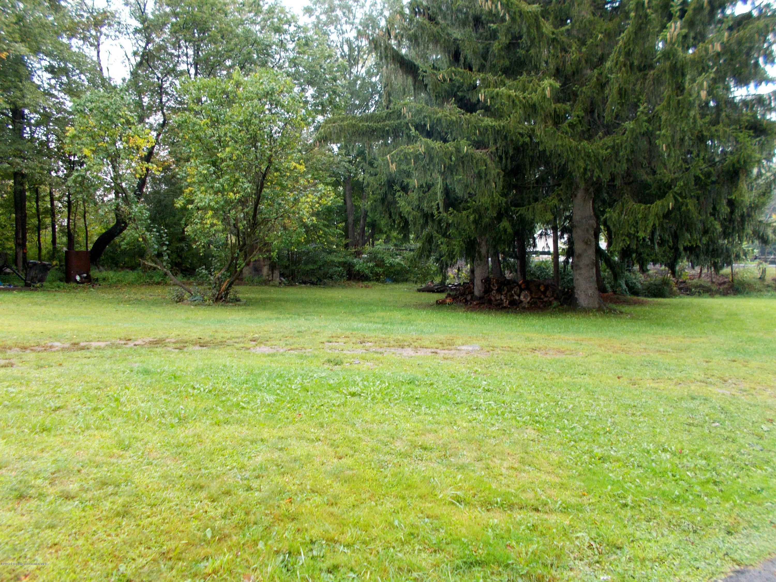 6 Watrees Rd Spring Brook Springfield, NJ 07081 - Photo 22 of 23 a view of a green field with trees in the background