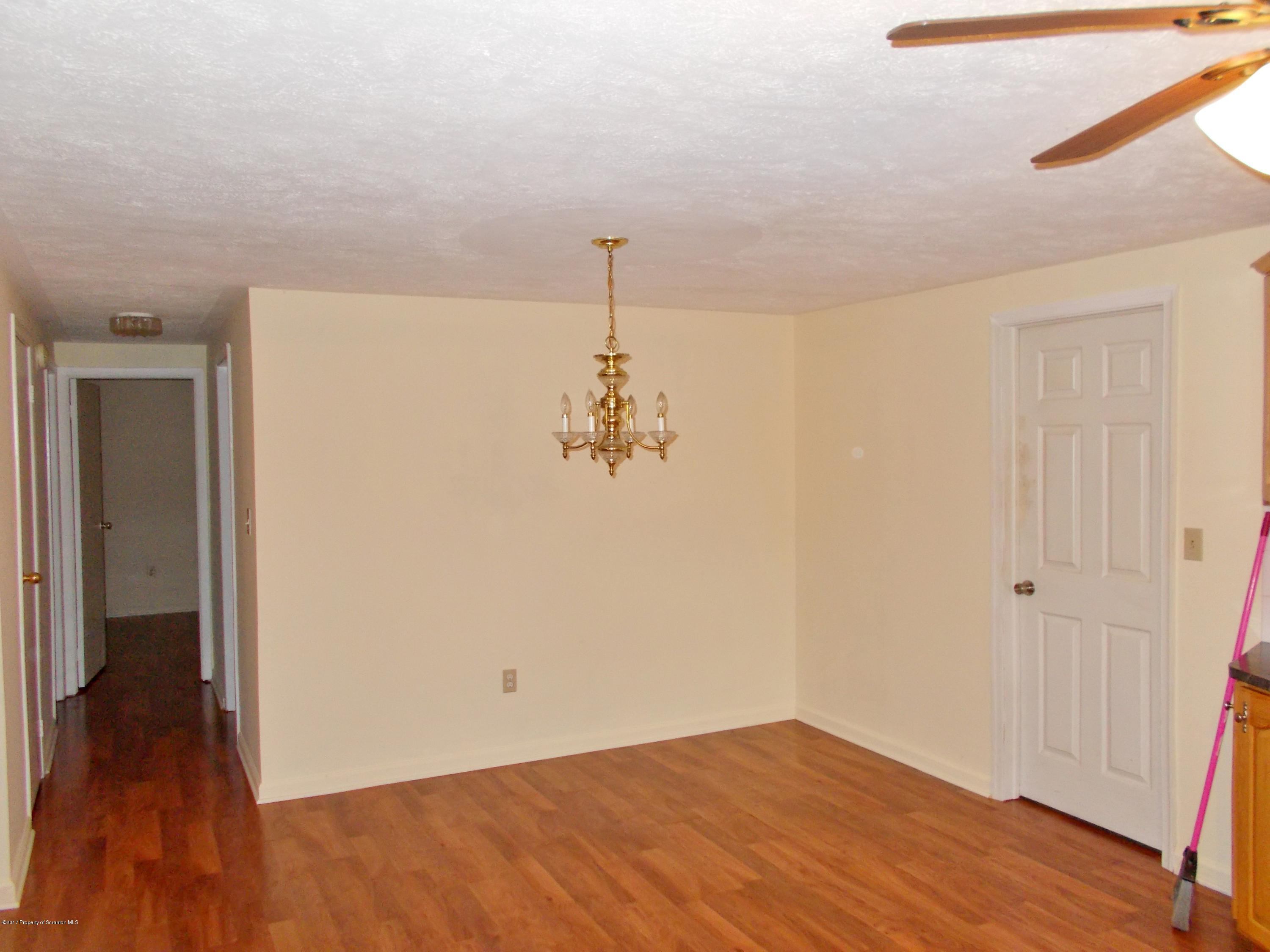 6 Watrees Rd Spring Brook Springfield, NJ 07081 - Photo 4 of 23 a view of a room with wooden floor and a ceiling fan