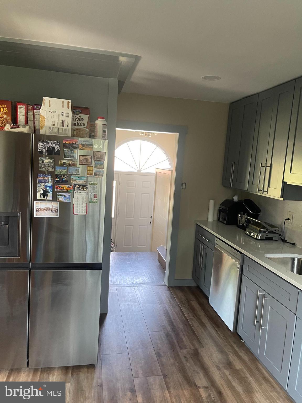123 Newtown Road Warminster, PA 18974 - Photo 7 of 10 a kitchen with stainless steel appliances granite countertop a refrigerator a stove and a wooden floors