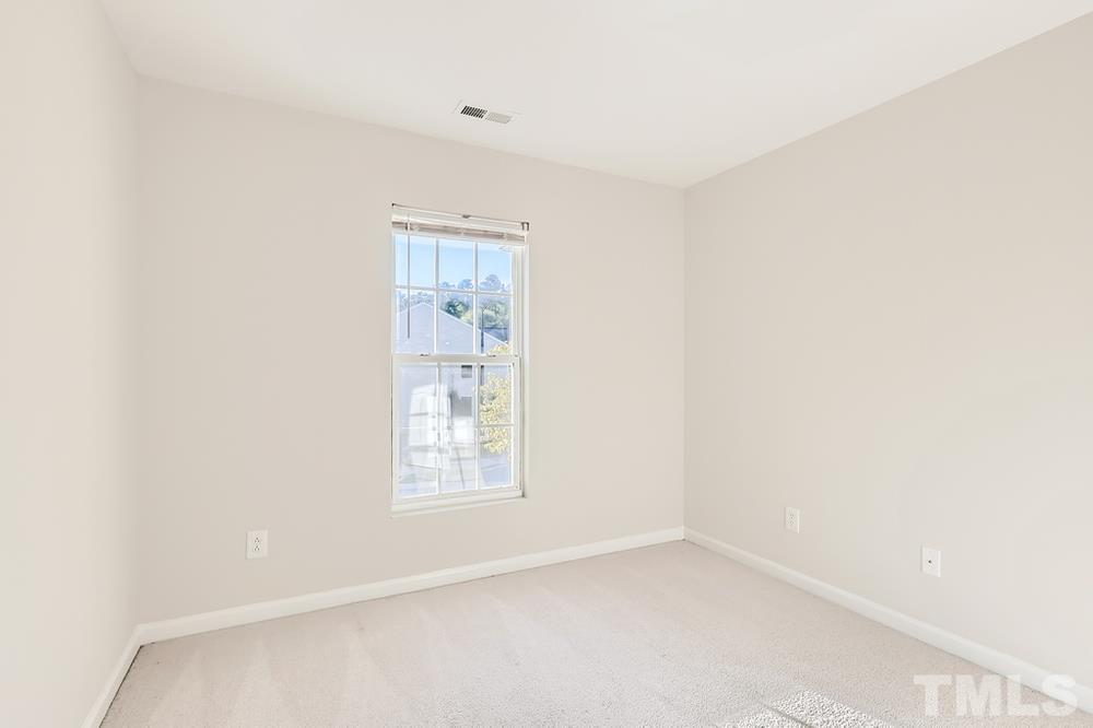 7010 Racine Way Raleigh, NC 27690 - Photo 22 of 27 an empty room with a window