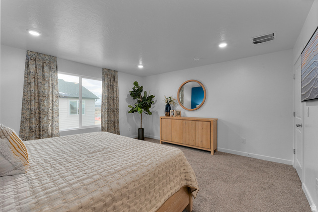 722 West 2840 South, Unit 8 Logan, UT 84321 - Photo 21 of 23 Bedroom featuring recessed lighting and carpet flooring
