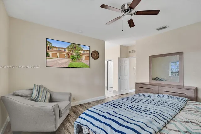 a bedroom with a bed and a couch