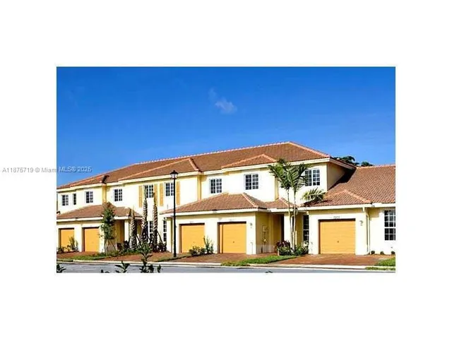 a view of a street with a houses