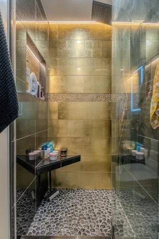 a bathroom with a sink and a shower