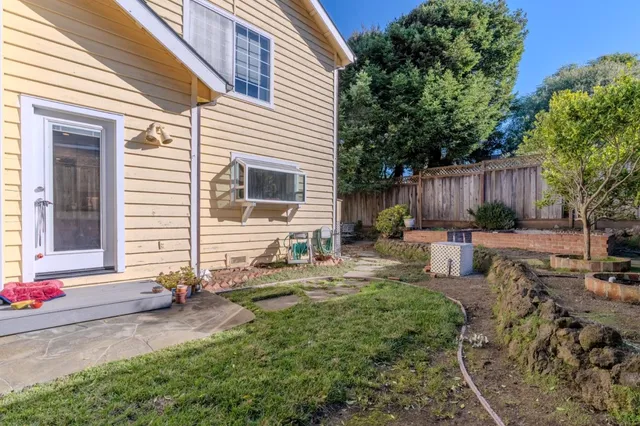 a view of a backyard with sitting area and furniture