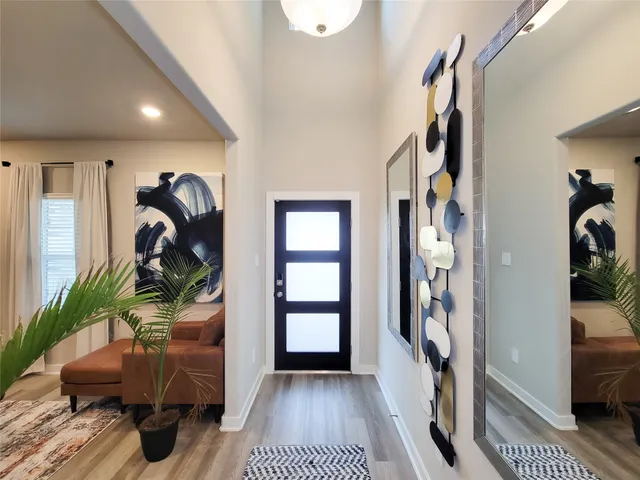 a bathroom with a toilet a sink and a mirror