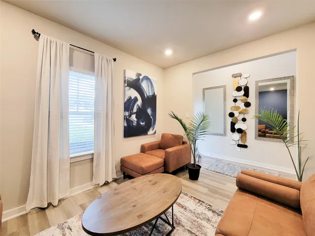 a en suite spacious bathroom with a tub shower and bedroom view
