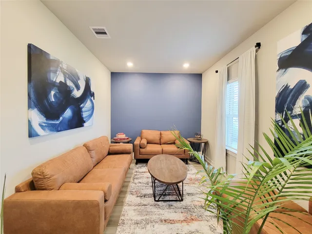 a bathroom with a white bath tub and a shower