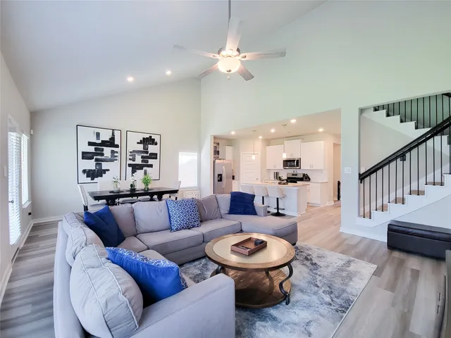 a kitchen with stainless steel appliances a stove a sink and a microwave