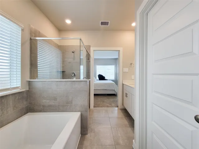 a view of a house with backyard and porch