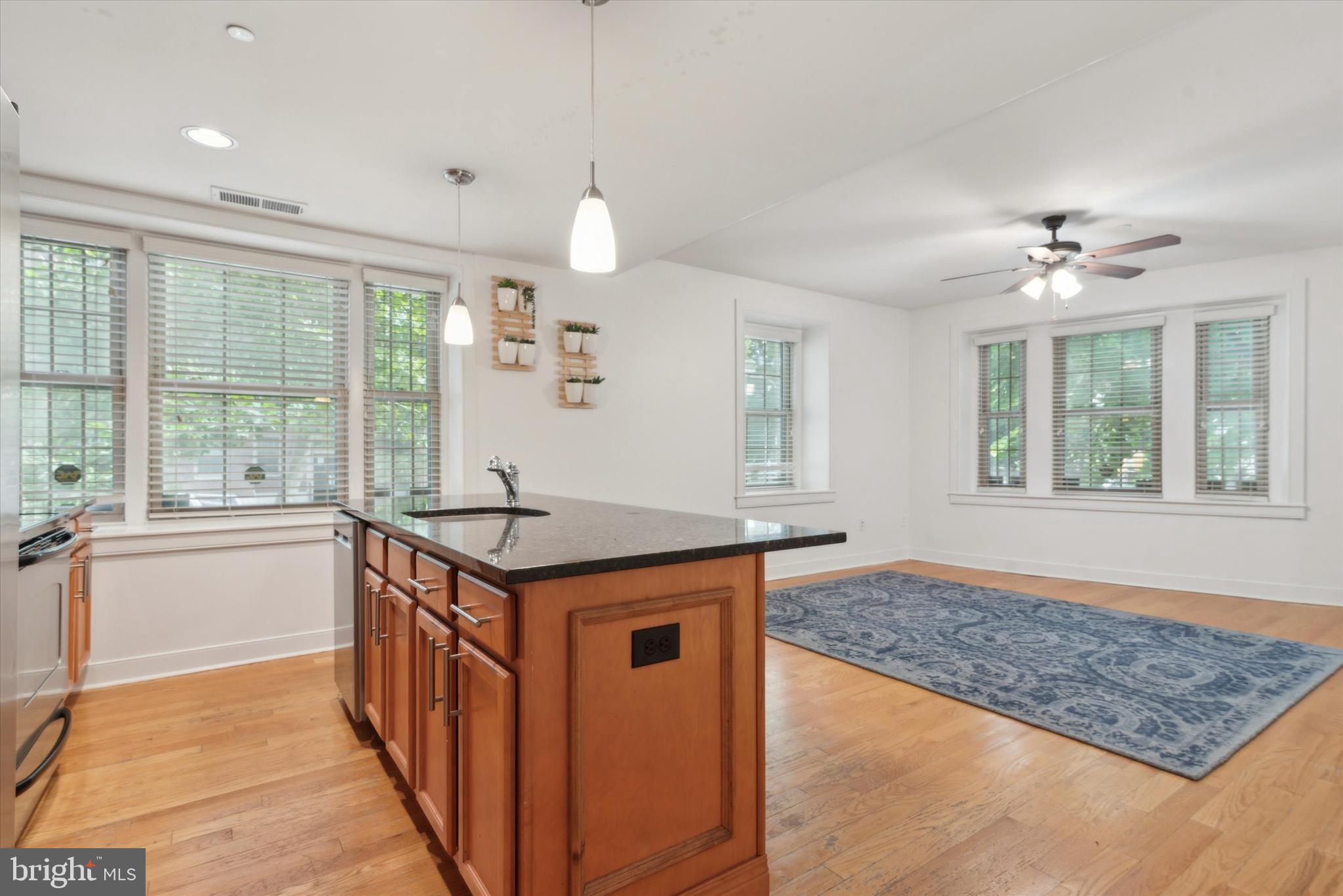 4300 Spruce Street, Unit A101 Philadelphia, PA 19104 - Photo 13 of 25 a kitchen with stainless steel appliances granite countertop a stove and a sink