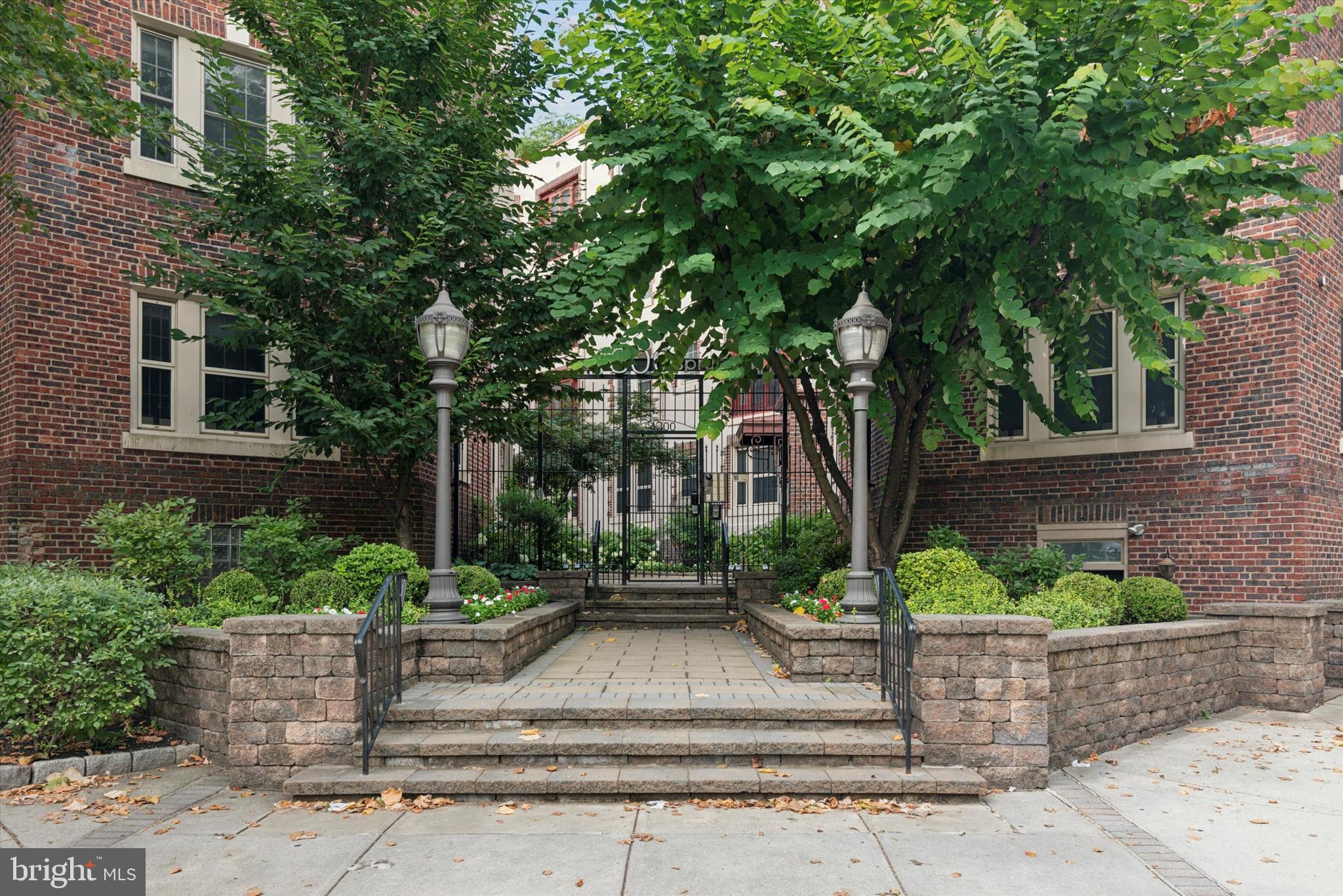 4300 Spruce Street, Unit A101 Philadelphia, PA 19104 - Photo 2 of 25 front view of a house with a tree