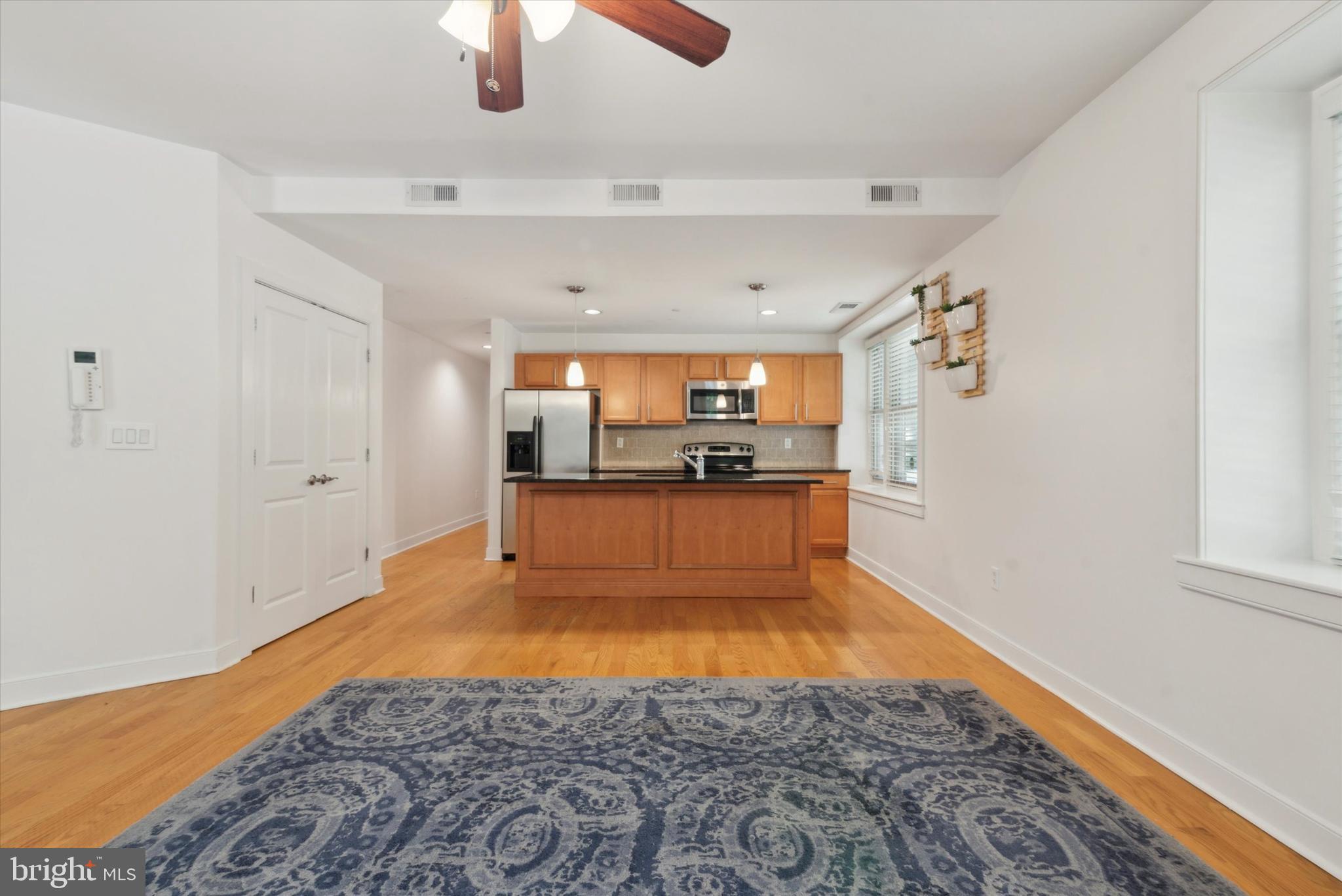 4300 Spruce Street, Unit A101 Philadelphia, PA 19104 - Photo 5 of 25 a view of a kitchen with microwave and cabinets