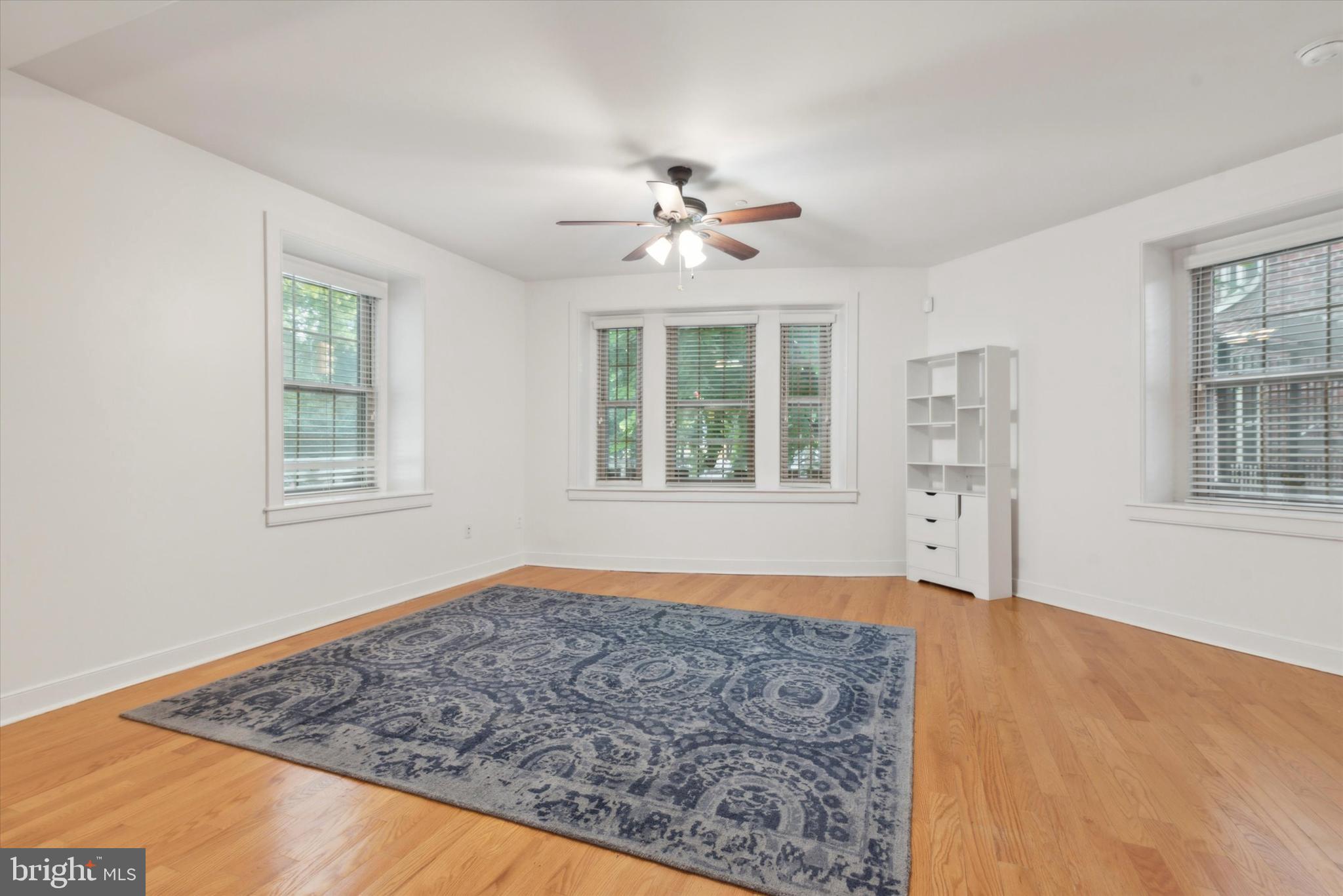 4300 Spruce Street, Unit A101 Philadelphia, PA 19104 - Photo 7 of 25 a view of an empty room with a window and cabinet