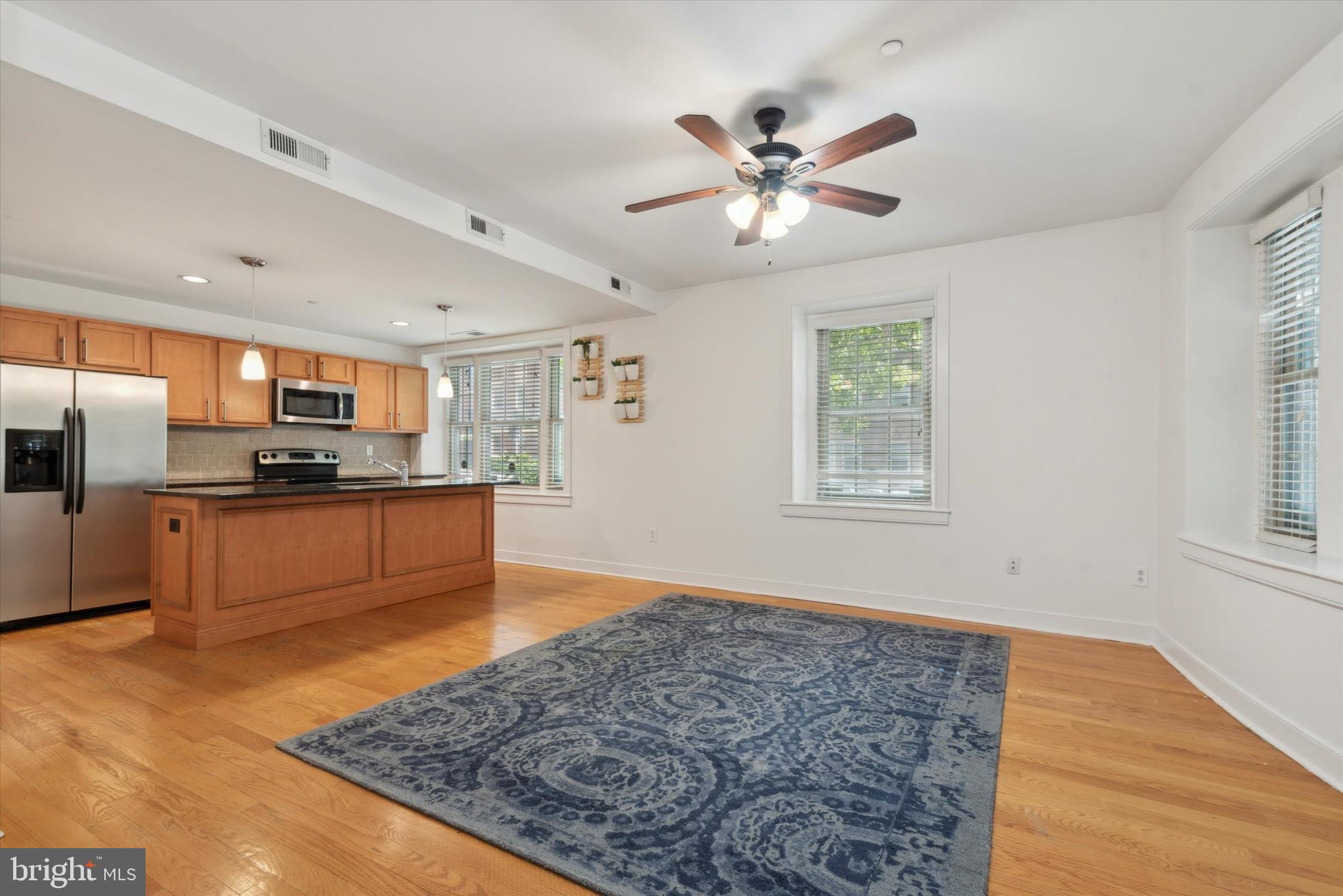 4300 Spruce Street, Unit A101 Philadelphia, PA 19104 - Photo 9 of 25 a large kitchen with a lot of counter space and stainless steel appliances