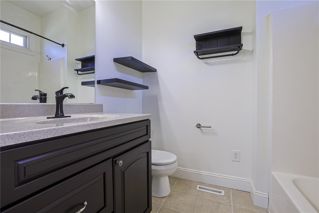 3681 Wilmington Road Lebanon, OH 45036 - Photo 33 of 87 This clean bathroom features a sleek vanity and convenient shelving, offering both style and functionality.