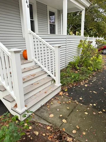 a view of balcony with wooden floor