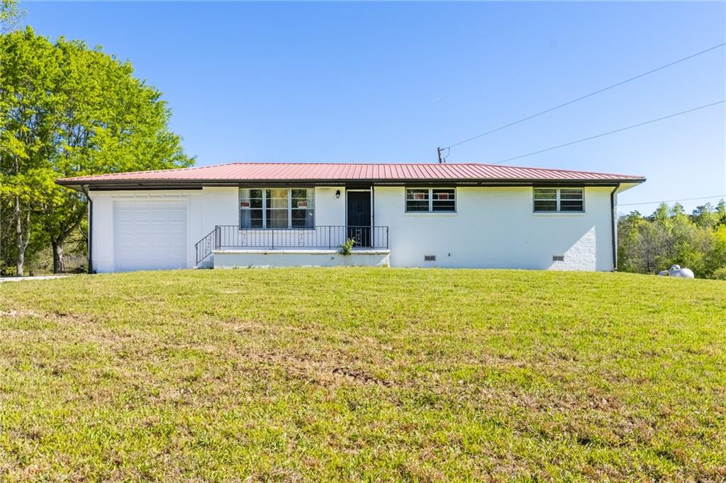 7596 Red Bud Road Northeast Ranger, GA 30734 - Photo 17 of 47 a front view of house with a garden