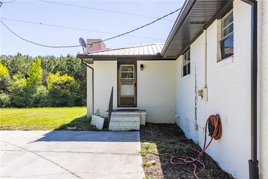 7596 Red Bud Road Northeast Ranger, GA 30734 - Photo 19 of 47 a front view of a house with garden