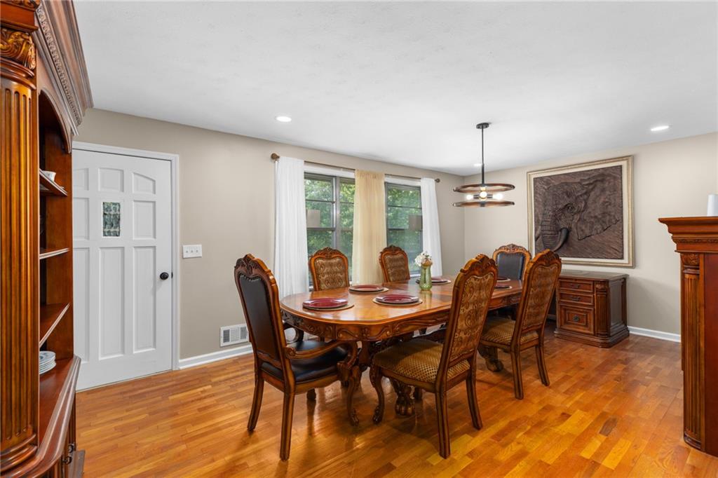 7596 Red Bud Road Northeast Ranger, GA 30734 - Photo 25 of 47 a view of a dining room with furniture window and wooden floor
