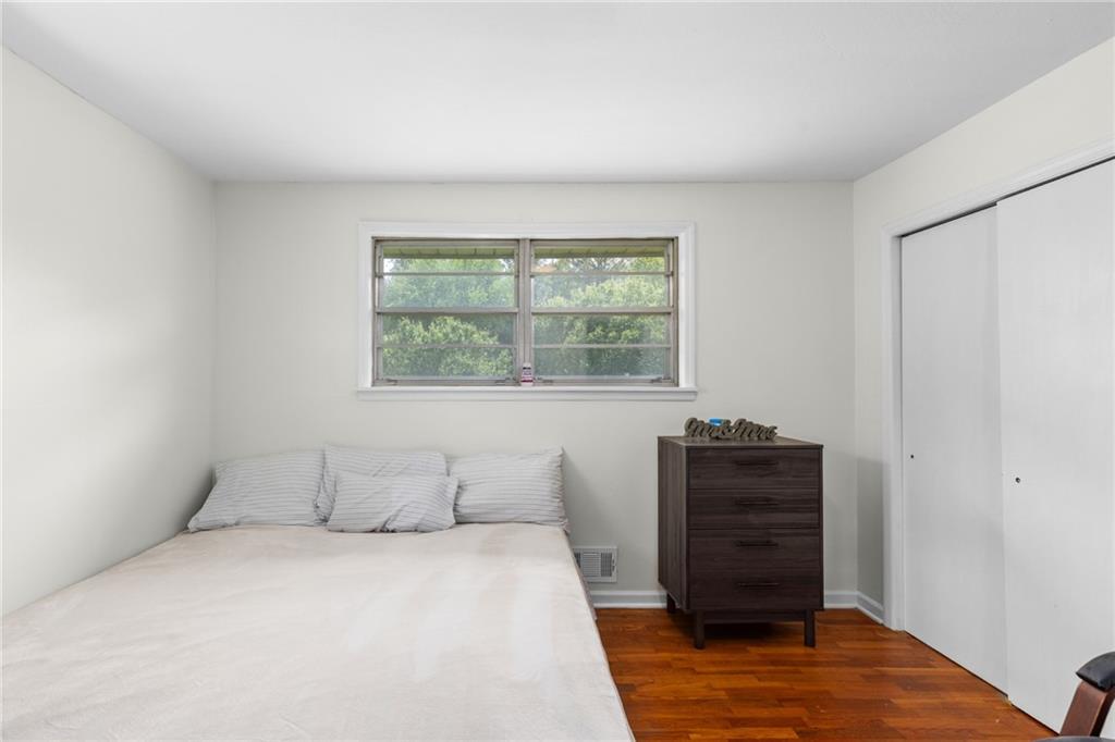 7596 Red Bud Road Northeast Ranger, GA 30734 - Photo 39 of 47 a bedroom with a bed and dresser