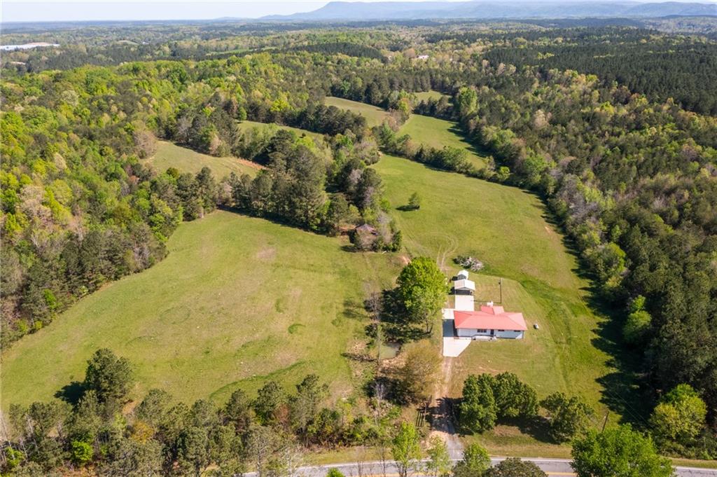 7596 Red Bud Road Northeast Ranger, GA 30734 - Photo 7 of 47 an aerial view of residential houses with outdoor space