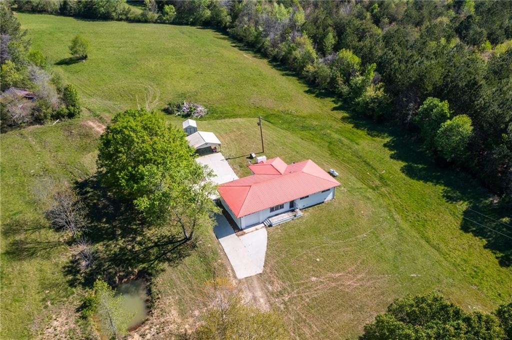 7596 Red Bud Road Northeast Ranger, GA 30734 - Photo 8 of 47 an aerial view of a house with a yard