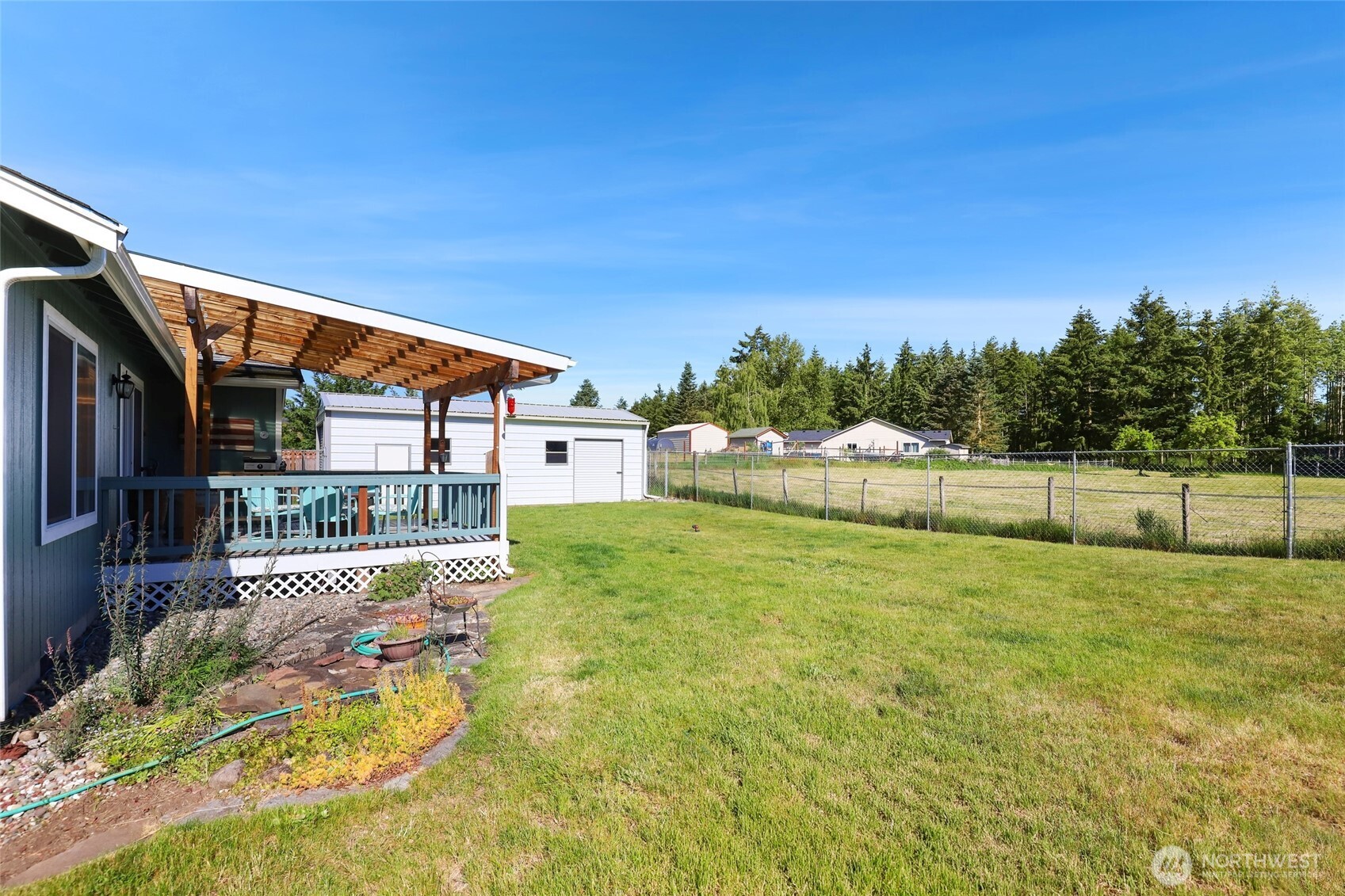 8008 188th Avenue Southwest Rochester, WA 98579 - Photo 36 of 40 a view of backyard with swimming pool and seating space
