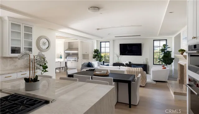 a living room with fireplace furniture and a flat screen tv