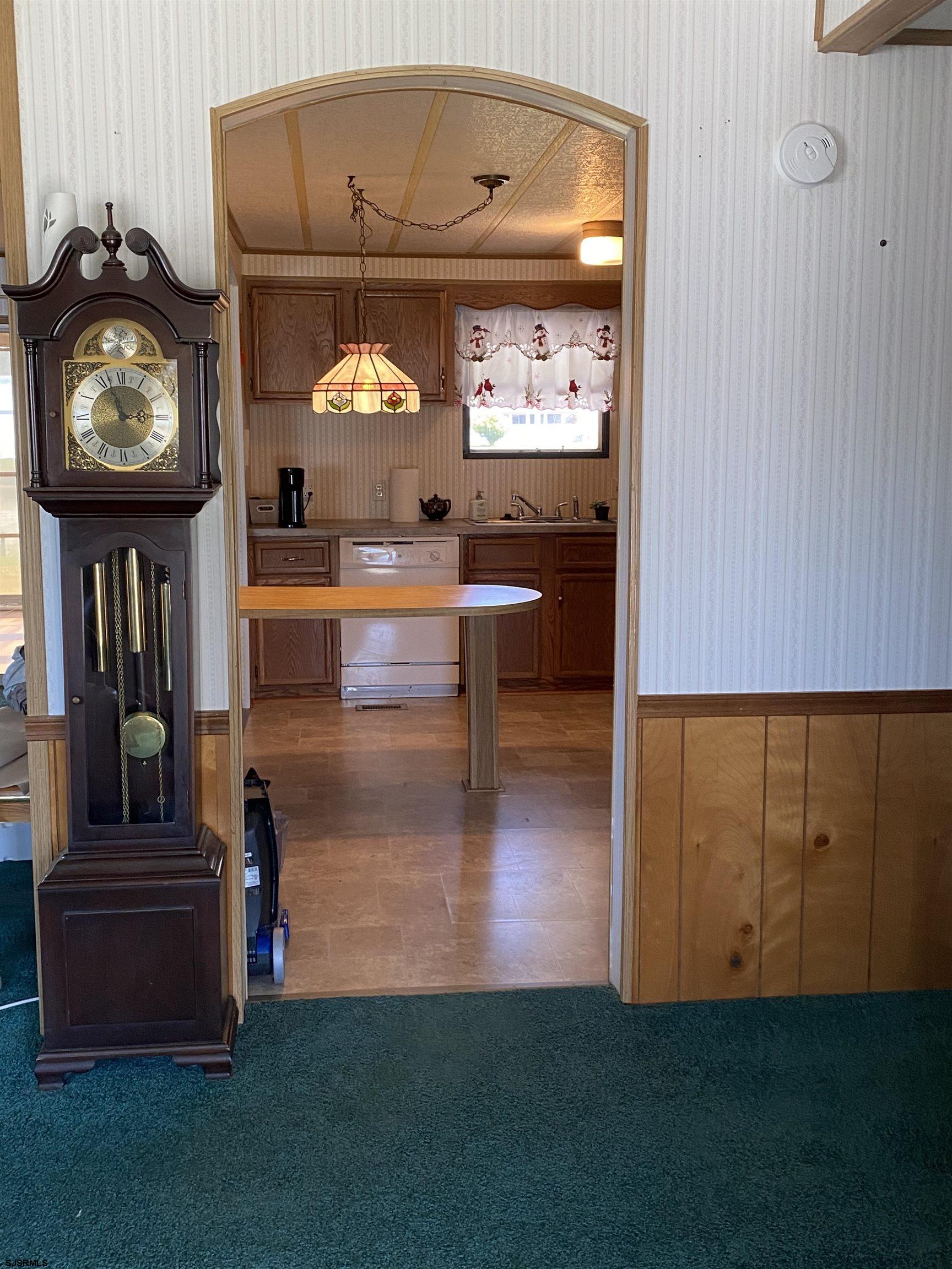 346 Puritan Drive Buena, NJ 08310 - Photo 11 of 22 a living room with furniture and a clock