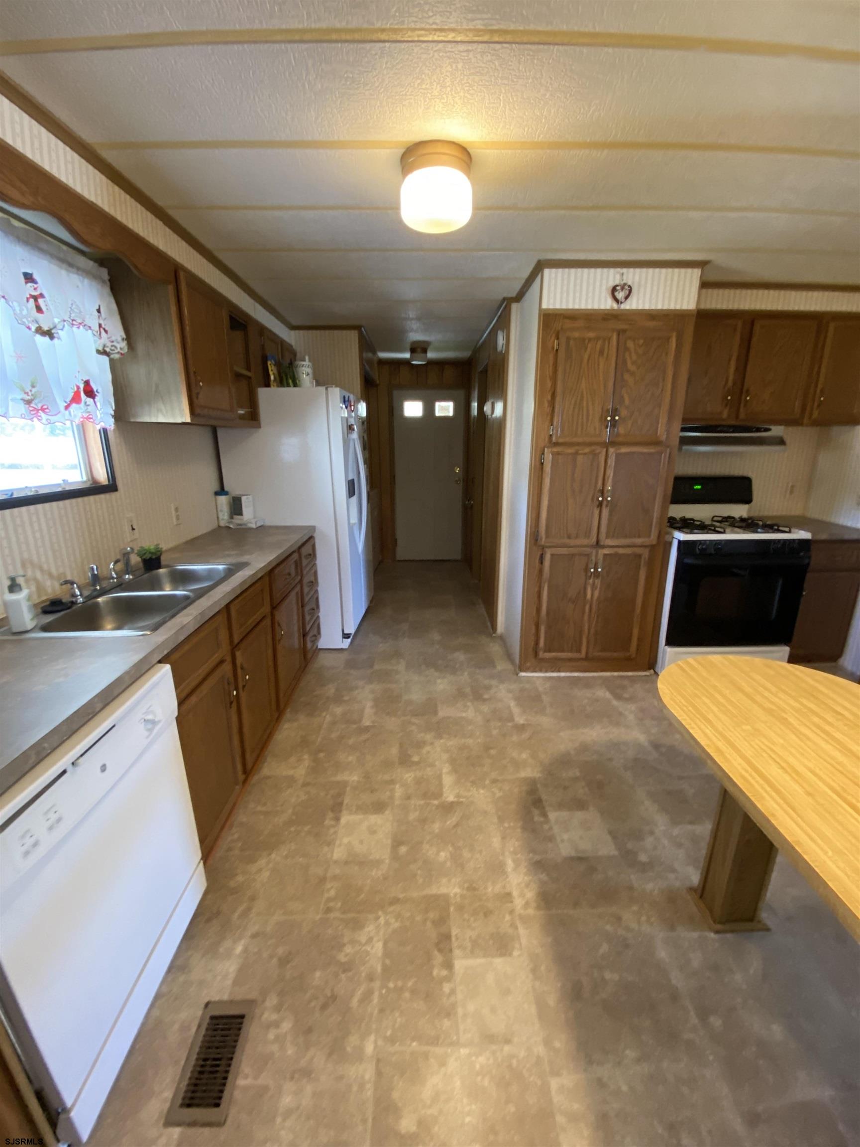 346 Puritan Drive Buena, NJ 08310 - Photo 15 of 22 a kitchen with stainless steel appliances granite countertop a sink and cabinets
