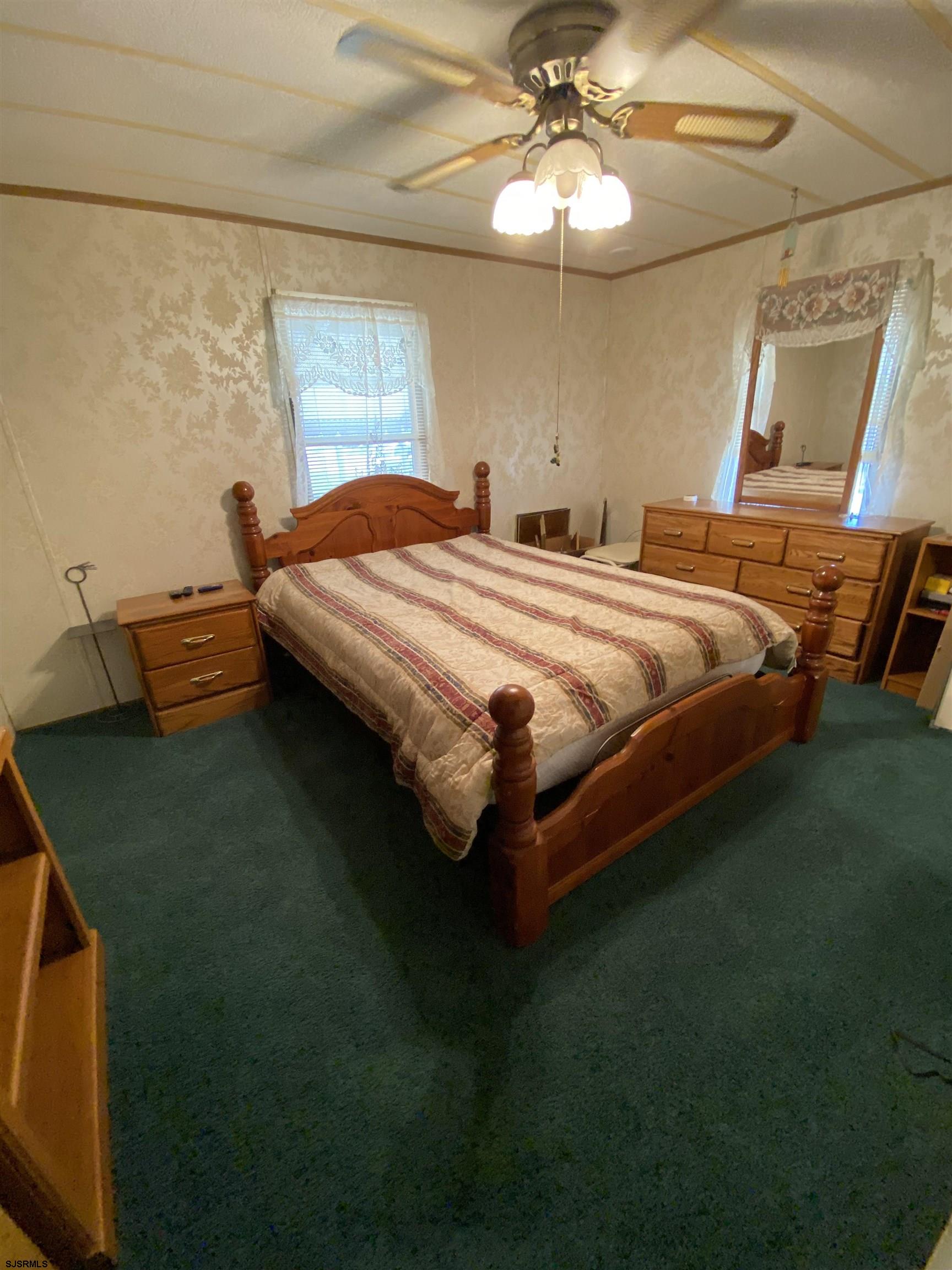 346 Puritan Drive Buena, NJ 08310 - Photo 17 of 22 a bedroom with a bed and a chandelier