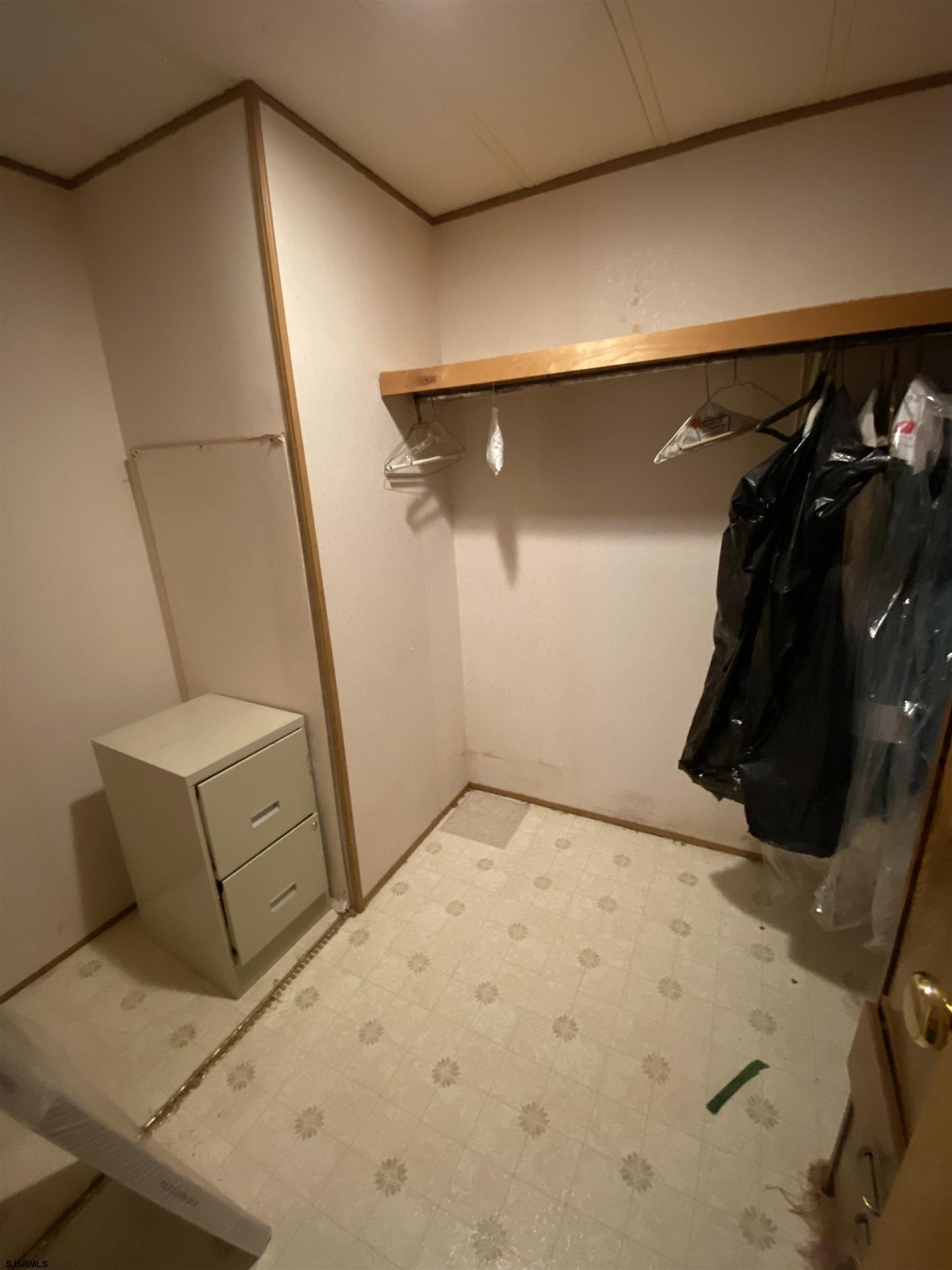 346 Puritan Drive Buena, NJ 08310 - Photo 19 of 22 a view of walk in closet with clothes and shoes