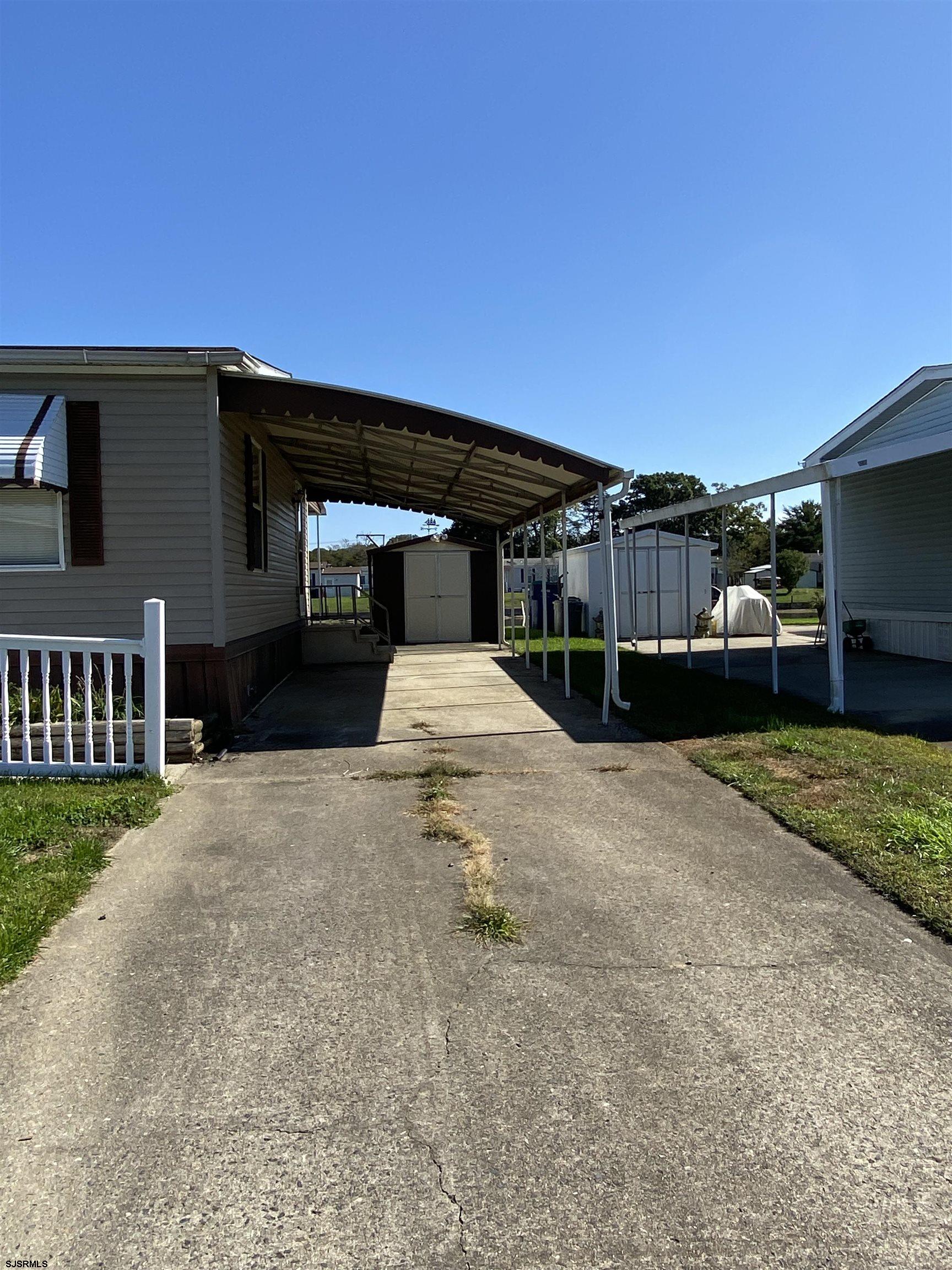 346 Puritan Drive Buena, NJ 08310 - Photo 3 of 22 a front view of a house with a yard
