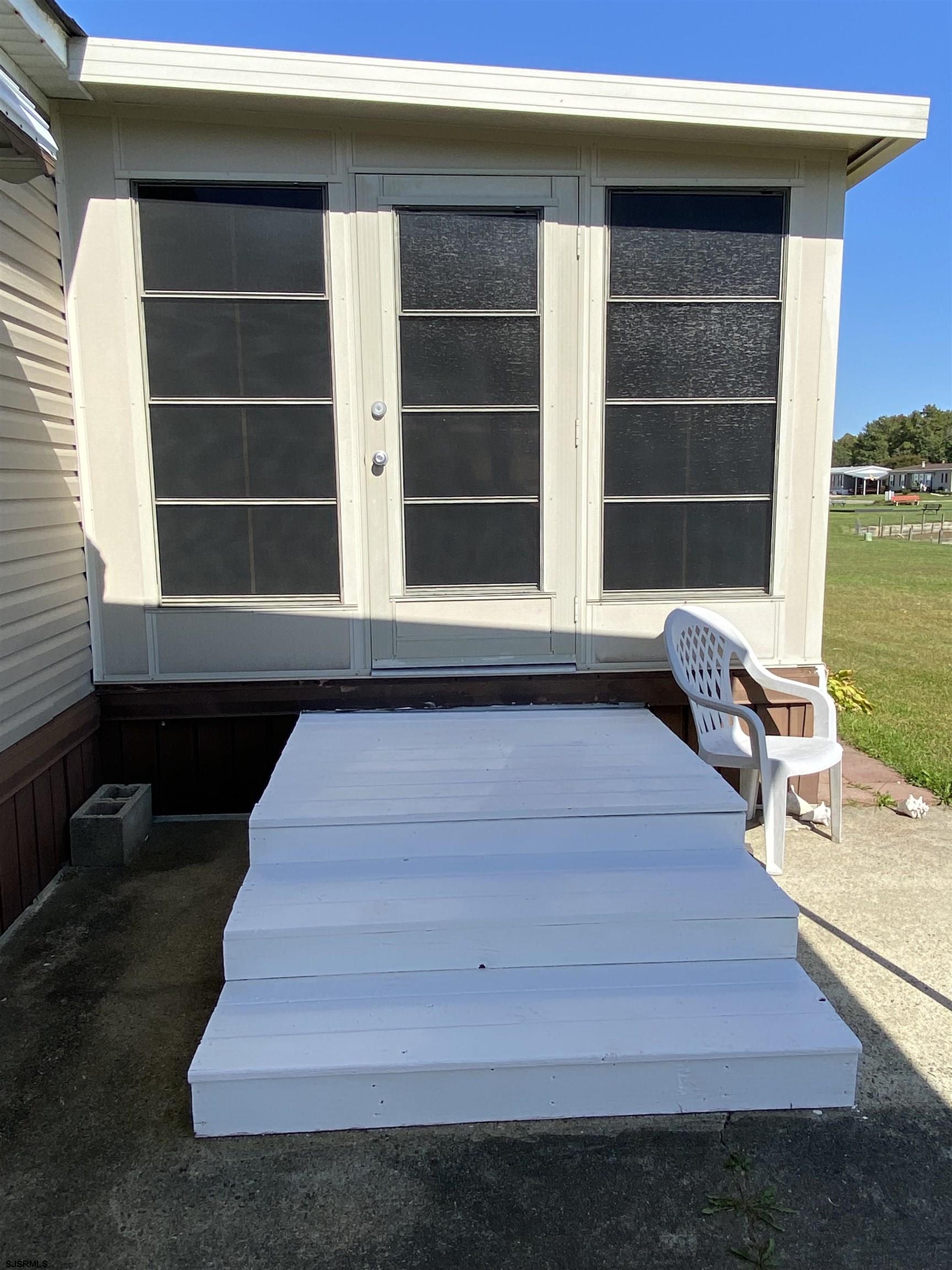 346 Puritan Drive Buena, NJ 08310 - Photo 7 of 22 a view of balcony with wooden floor and windows