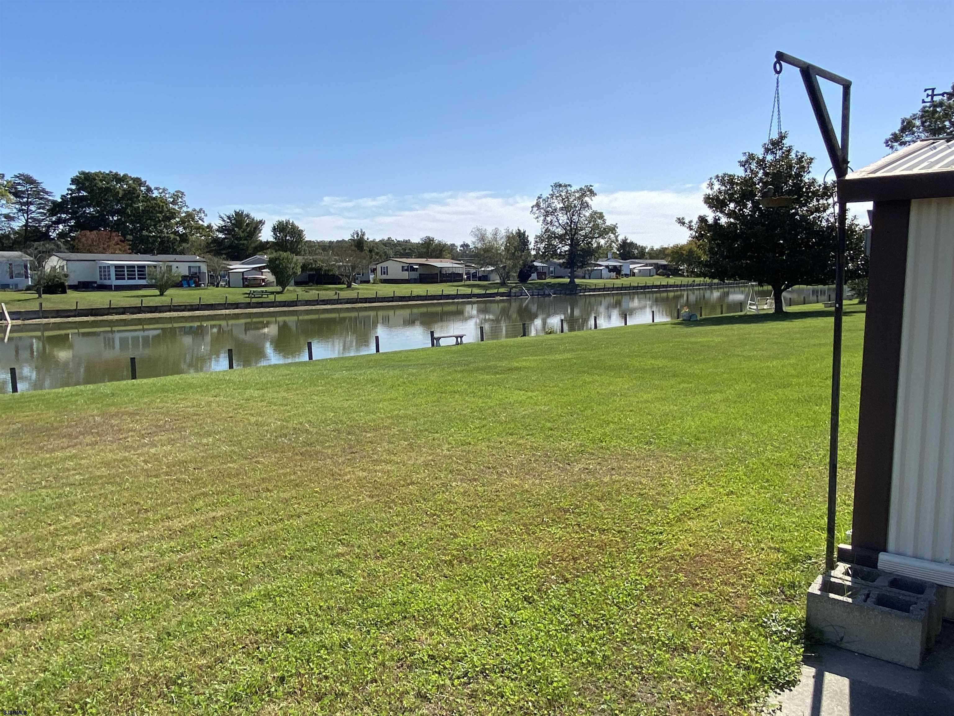 346 Puritan Drive Buena, NJ 08310 - Photo 8 of 22 a view of a lake with a big yard