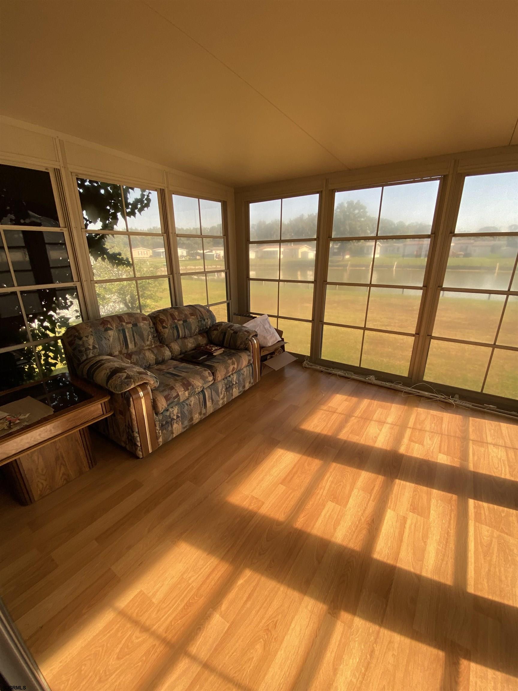 346 Puritan Drive Buena, NJ 08310 - Photo 10 of 22 a living room with furniture and a floor to ceiling window