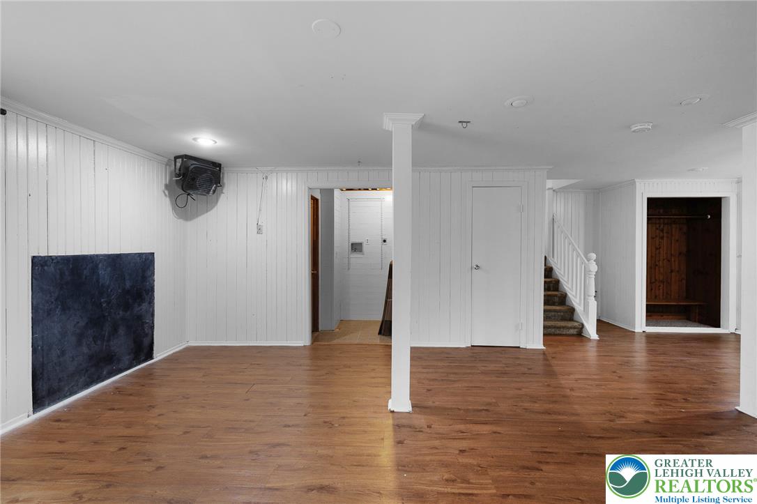 256 Sundance Road Effort, PA 18330 - Photo 52 of 83 a view of an empty room with wooden floor and staircase