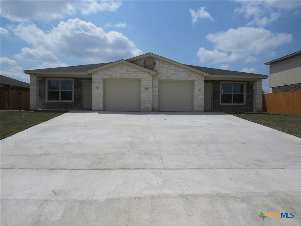 1108 Stealth Lane, Unit A Killeen, TX 76549 - Photo 1 of 21 a front view of a house with yard and trees