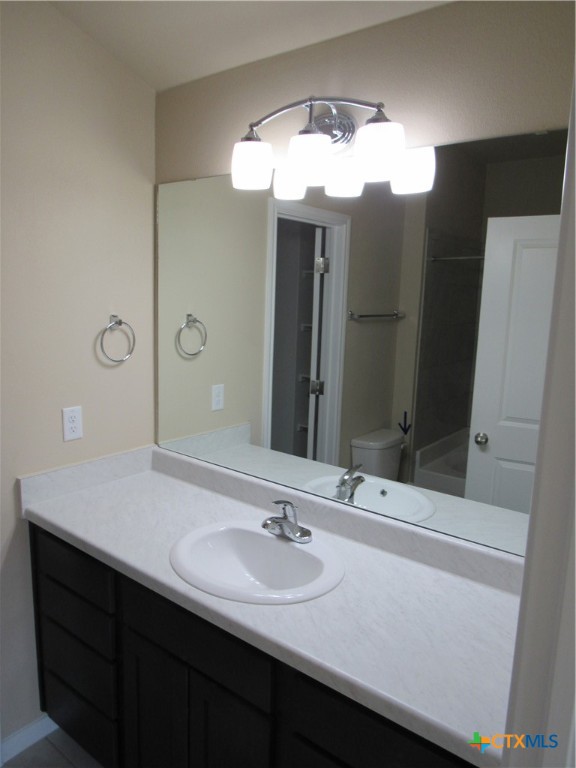 1108 Stealth Lane, Unit A Killeen, TX 76549 - Photo 11 of 21 a bathroom with a sink and a mirror