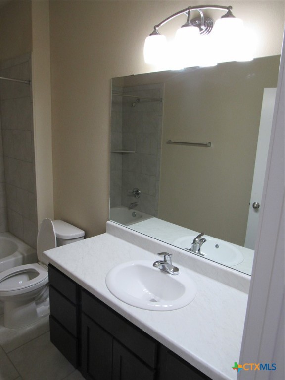 1108 Stealth Lane, Unit A Killeen, TX 76549 - Photo 16 of 21 a bathroom with a sink toilet and mirror