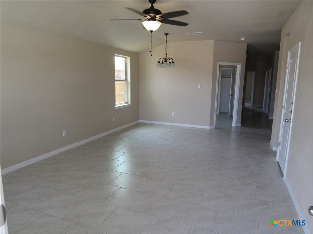 1108 Stealth Lane, Unit A Killeen, TX 76549 - Photo 3 of 21 wooden floor in an empty room with a window